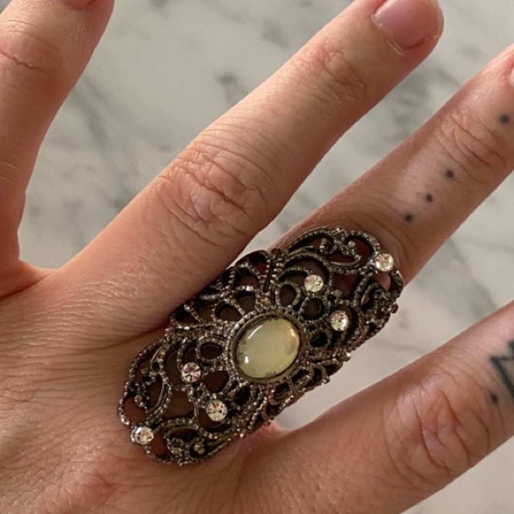 Silver Filigree Ring with Intricate Design and Central Stone